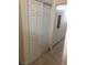 View of sliding closet doors along hallway with tan tile flooring at 5655 E Sahara Ave # 1037, Las Vegas, NV 89142