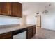 Kitchen with dark cabinets, countertop space, and a view into the main living area at 5655 E Sahara Ave # 1037, Las Vegas, NV 89142