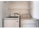 Laundry area featuring a modern Samsung washing machine and a dryer with a wire shelf above at 5655 E Sahara Ave # 1037, Las Vegas, NV 89142