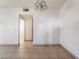 Open living area with tile flooring, neutral walls, and doorway access to other rooms at 5655 E Sahara Ave # 1037, Las Vegas, NV 89142