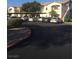 A parking lot in front of an apartment building with covered parking at 5655 E Sahara Ave # 1037, Las Vegas, NV 89142