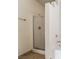 Walk-in shower featuring a glass door, tiled walls, and updated fixtures at 5655 E Sahara Ave # 1037, Las Vegas, NV 89142