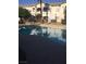 A community swimming pool is fenced and has some plants around it at 5655 E Sahara Ave # 1037, Las Vegas, NV 89142