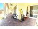 Expansive back patio with brick pavers, ceiling fans, and outdoor seating at 6009 La Coste St, North Las Vegas, NV 89081