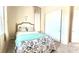 Bright bedroom featuring a comfortable bed, soft linens, and a closet with sliding doors at 6009 La Coste St, North Las Vegas, NV 89081