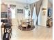 Dining area with a chandelier, a round table with seating for five, and sliding door access to the exterior at 6009 La Coste St, North Las Vegas, NV 89081