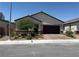 Charming single-story home with a well-maintained front yard and a brick-paved driveway and front walkway at 6009 La Coste St, North Las Vegas, NV 89081