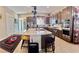 Spacious kitchen featuring a large island with seating, stainless steel appliances, and modern cabinetry at 6009 La Coste St, North Las Vegas, NV 89081