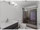 Tiled bathroom featuring tiled shower, modern fixtures, and a sleek vanity at 6017 Natures Dr, Las Vegas, NV 89122
