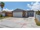 Charming single-story home with a two-car garage and spacious front driveway at 6017 Natures Dr, Las Vegas, NV 89122