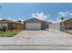 Charming single-story home with a two-car garage and spacious concrete driveway at 6017 Natures Dr, Las Vegas, NV 89122