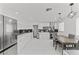 Modern kitchen featuring stainless steel appliances, sleek cabinets, and dining area at 6017 Natures Dr, Las Vegas, NV 89122