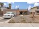 Charming single-story home featuring a cozy front porch and well-maintained gravel landscaping at 604 N Torrey Pines Dr, Las Vegas, NV 89107
