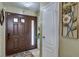 Inviting foyer with a decorative mirror and a stylish rug with tile flooring at 604 N Torrey Pines Dr, Las Vegas, NV 89107