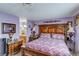 Main bedroom showcasing an ornate bed frame and adjacent vanity area at 604 N Torrey Pines Dr, Las Vegas, NV 89107
