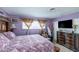 Main bedroom with a large dresser and a peaceful window view at 604 N Torrey Pines Dr, Las Vegas, NV 89107