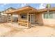 Covered patio with a built-in BBQ and a comfortable wooden bench, perfect for outdoor dining and relaxation at 604 N Torrey Pines Dr, Las Vegas, NV 89107