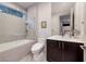 Modern bathroom boasts a soaking tub, frameless glass shower, and a contemporary vanity at 609 Sleeping Dragon Dr, Henderson, NV 89012