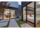Captivating courtyard view showcasing outdoor walkway connecting the modern dining and bedroom areas with a serene vibe at 609 Sleeping Dragon Dr, Henderson, NV 89012