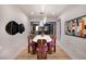Stylish dining room with modern lighting and artistic decor at 609 Sleeping Dragon Dr, Henderson, NV 89012