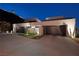 Wide driveway with three-car garage and modern desert landscaping at 609 Sleeping Dragon Dr, Henderson, NV 89012