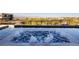 Relaxing hot tub with overflowing water and a view of the city at 609 Sleeping Dragon Dr, Henderson, NV 89012
