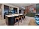 Modern kitchen features a large island with seating and stainless steel appliances, with an open floorplan at 609 Sleeping Dragon Dr, Henderson, NV 89012