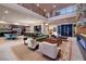 Spacious open-concept living area, featuring a modern kitchen, dining space, and comfortable seating with contemporary design at 609 Sleeping Dragon Dr, Henderson, NV 89012