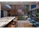 Open-concept living area with a modern kitchen, dining space, and comfortable seating, perfect for entertaining at 609 Sleeping Dragon Dr, Henderson, NV 89012