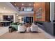Elegant living room with fireplace and wood feature wall, offering a stylish and comfortable gathering space at 609 Sleeping Dragon Dr, Henderson, NV 89012