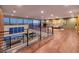 Bright living room boasts an open floor plan, city view windows, and hardwood floors at 609 Sleeping Dragon Dr, Henderson, NV 89012