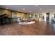 Spacious living room features a piano, hardwood floors, and a designer area rug at 609 Sleeping Dragon Dr, Henderson, NV 89012