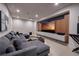 Comfortable living room with large sectional sofa, built-in entertainment center, and neutral carpeting at 609 Sleeping Dragon Dr, Henderson, NV 89012