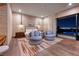 Relaxing main bedroom with plush armchairs and a sliding glass door to enjoy views of the city lights at 609 Sleeping Dragon Dr, Henderson, NV 89012