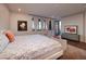 Spacious main bedroom offers hardwood floors, neutral walls, and city views at 609 Sleeping Dragon Dr, Henderson, NV 89012