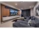 Modern media room with a large screen, comfortable seating, and stylish decor for home entertainment at 609 Sleeping Dragon Dr, Henderson, NV 89012