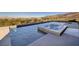 A modern pool and jacuzzi featuring views of the surrounding mountain landscape at 609 Sleeping Dragon Dr, Henderson, NV 89012