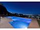 Backyard with a pool and spa offering panoramic city views at night at 609 Sleeping Dragon Dr, Henderson, NV 89012