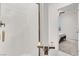 Bright bathroom with white tiled shower and modern hardware at 6618 Palm Branch St, North Las Vegas, NV 89086