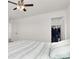 Bright bedroom with ceiling fan and closet at 6618 Palm Branch St, North Las Vegas, NV 89086