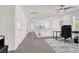 Open and bright carpeted hallway with a desk, closet, and natural light at 6618 Palm Branch St, North Las Vegas, NV 89086