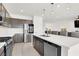 Open concept kitchen with granite countertops, stainless steel appliances, and large island with seating at 6618 Palm Branch St, North Las Vegas, NV 89086