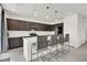 Modern kitchen featuring granite countertops, stainless steel appliances, and island seating at 6618 Palm Branch St, North Las Vegas, NV 89086