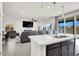 Bright, open-concept living room features modern lighting and a seamless transition to the backyard at 6618 Palm Branch St, North Las Vegas, NV 89086