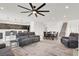 Spacious open floor plan living room features recessed lighting, neutral tones, and tile flooring throughout at 6618 Palm Branch St, North Las Vegas, NV 89086