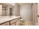 Bathroom features a modern sink, mirror and tiled shower at 7885 W Flamingo Rd # 2003, Las Vegas, NV 89147