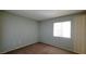 Bedroom featuring neutral carpet and walls, and a bright window at 7885 W Flamingo Rd # 2003, Las Vegas, NV 89147