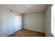 Bedroom featuring neutral carpet and walls, a closet with white doors, and a bright window at 7885 W Flamingo Rd # 2003, Las Vegas, NV 89147