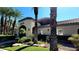 Clubhouse building with lush landscaping and exterior stone accents at 7885 W Flamingo Rd # 2003, Las Vegas, NV 89147