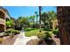 Community common area featuring lush landscaping, mature trees and walking path at 7885 W Flamingo Rd # 2003, Las Vegas, NV 89147